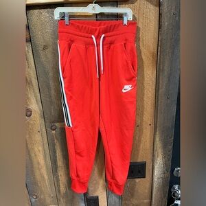 Nike Red Track Pants with Tapered Fit and Elastic Cuffs